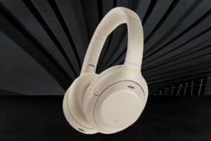 White Sony headphones floating on a black background