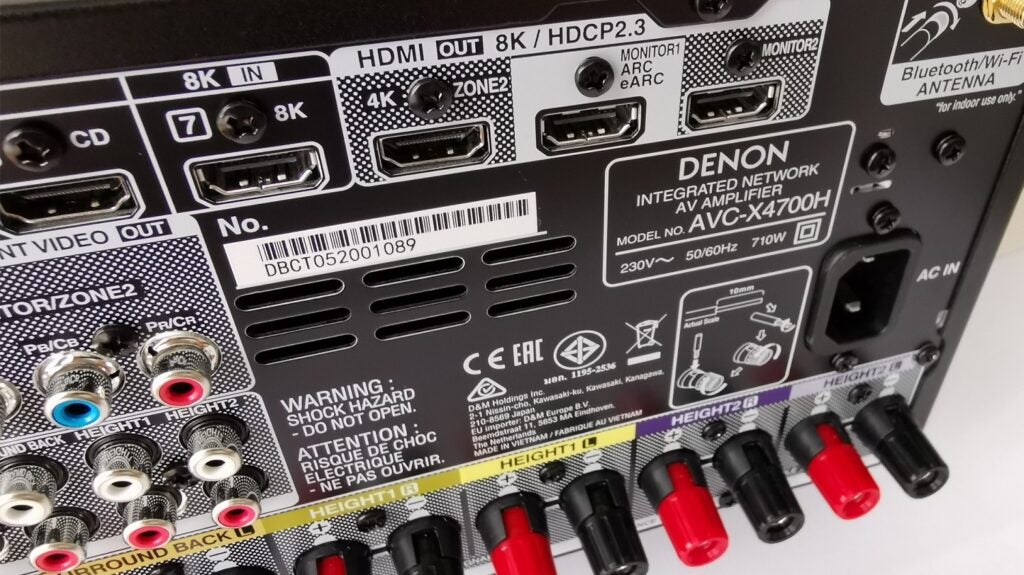 back side of denon amplifier system showing connections from power to Hdmi